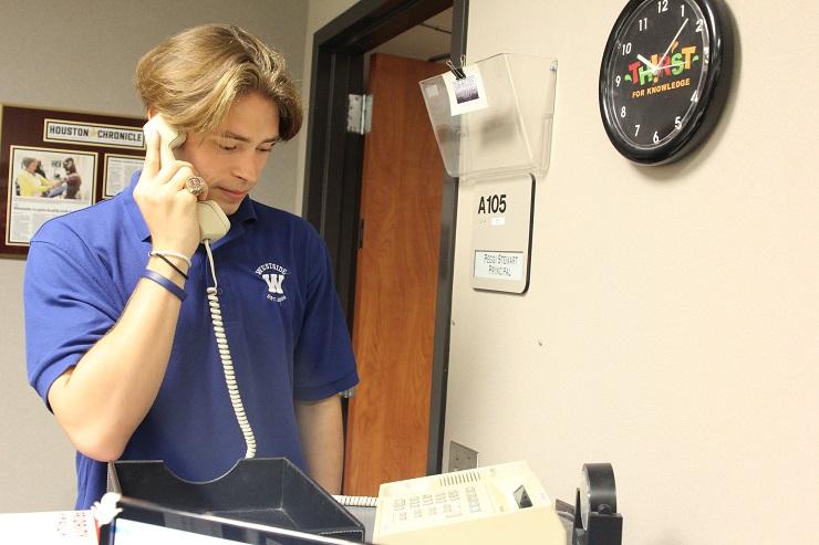 Nick Ford, at his station for the morning announcements